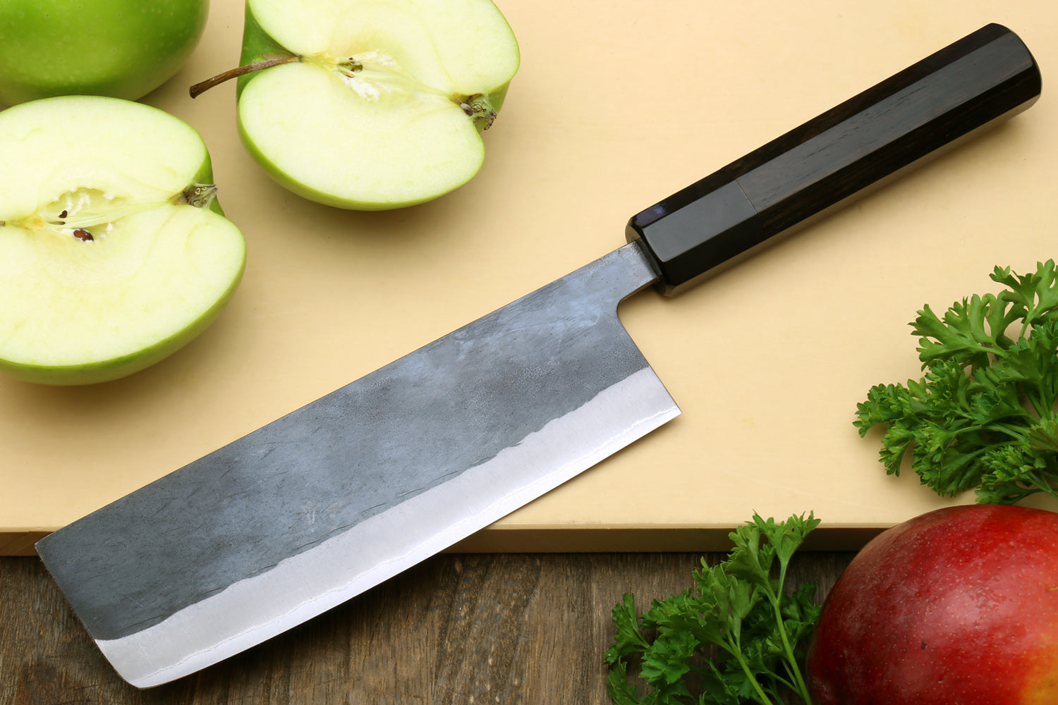 Nakiri Japanese vegetable knife with black handle and wide blue-steel blade