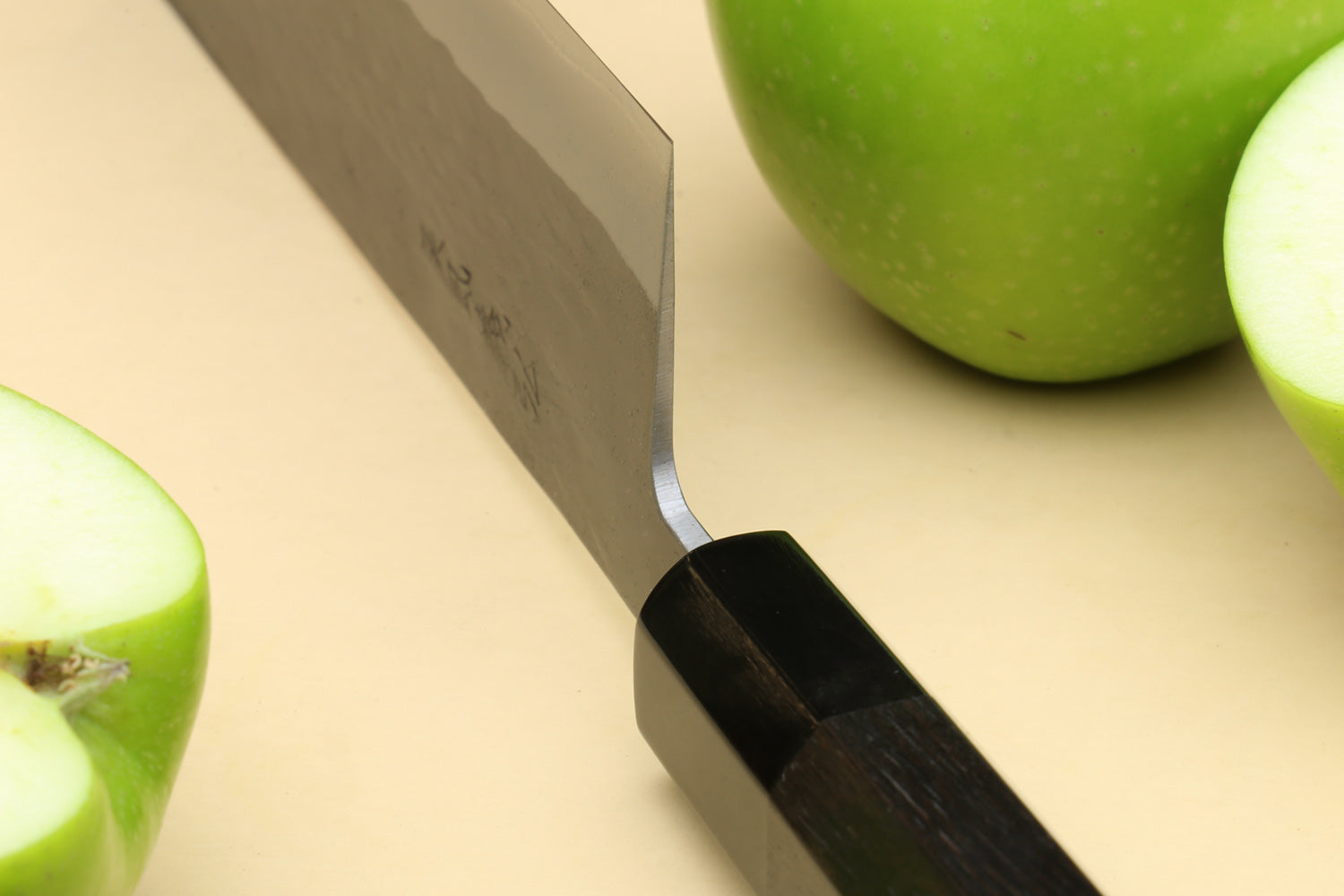 Nakiri vegetable knife showing spine and black ebony handle end