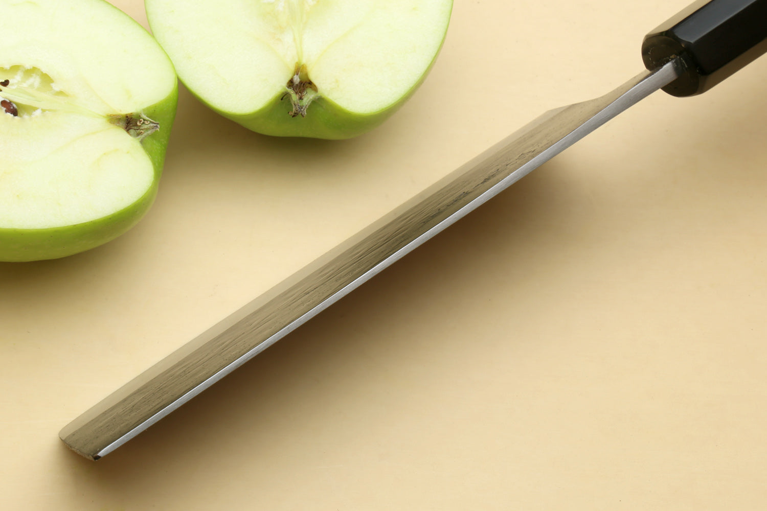 Nakiri knife profile with black ebony handle and wide blue-steel blade