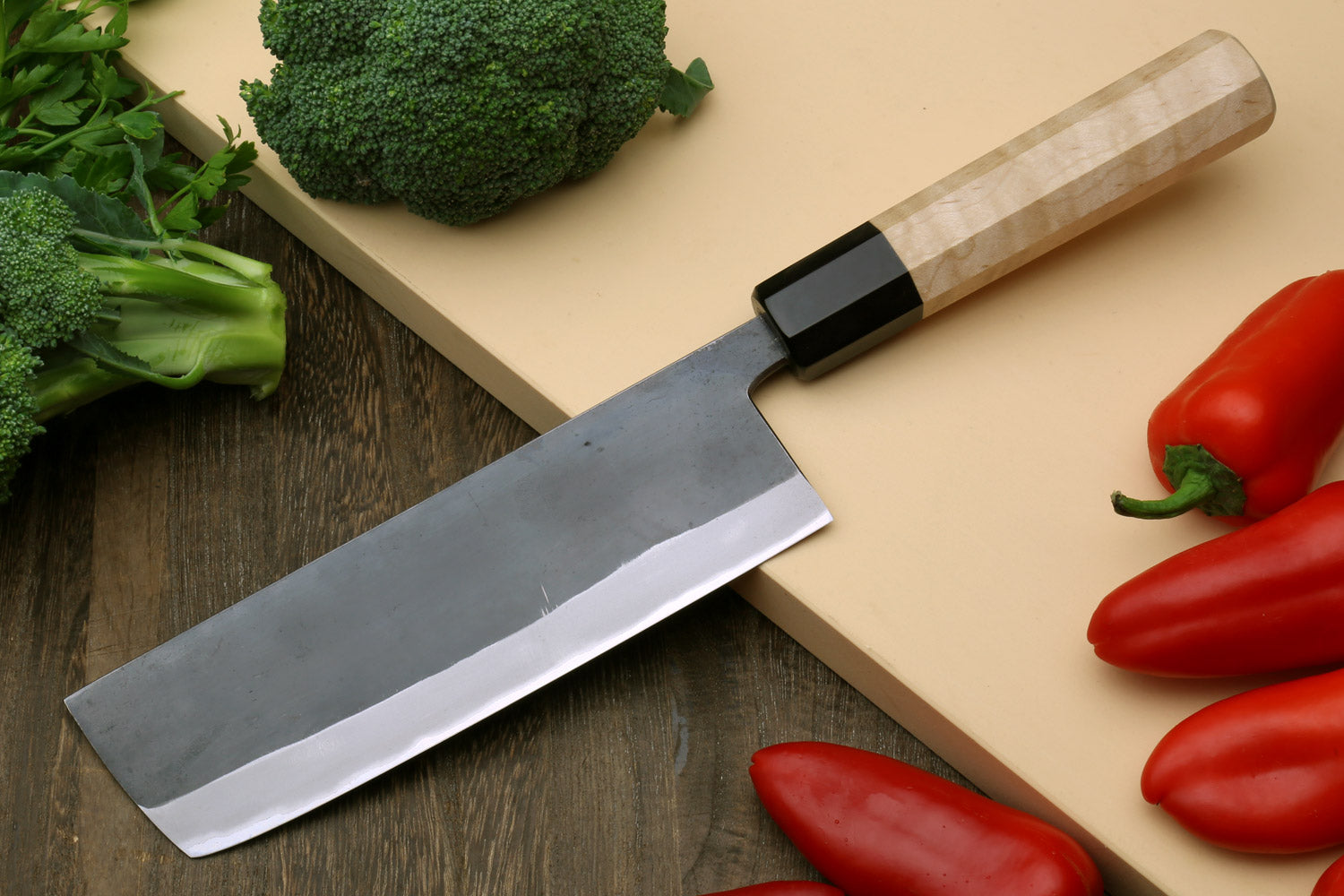 Nakiri vegetable knife angled view, black handle and gray stainless-steel blade