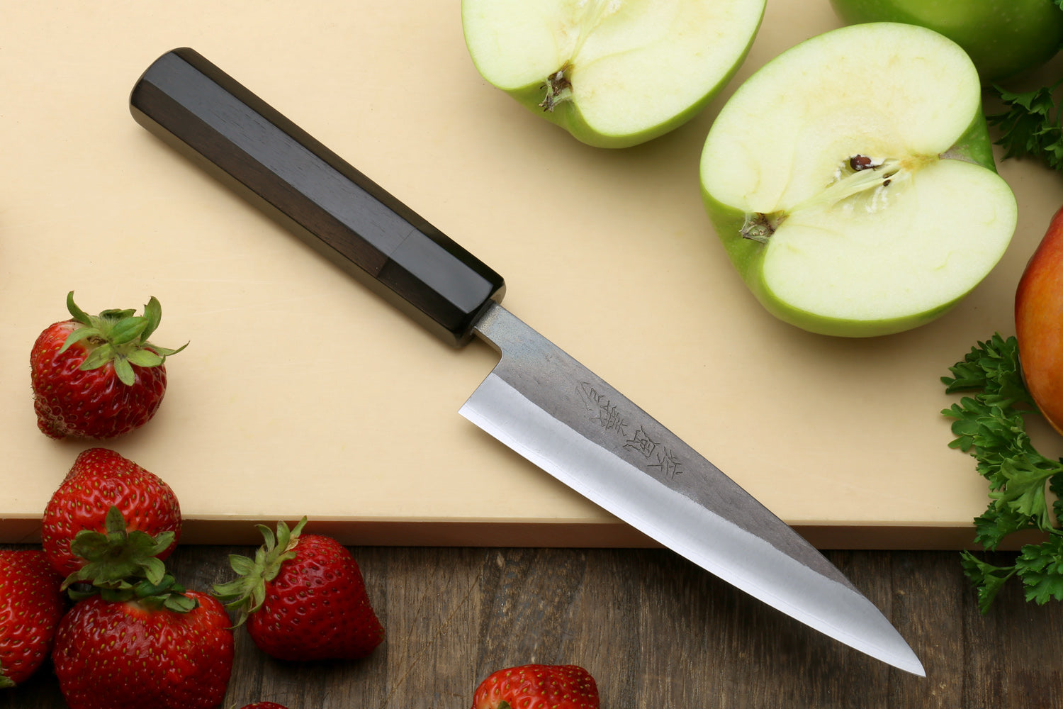 Petty utility knife with dark ebony handle and forged stainless blade, pointed tip