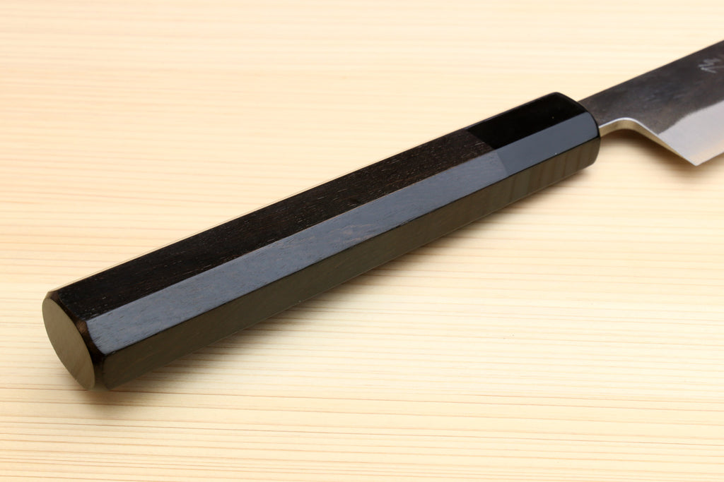 Ebony-handled slicer knife with long silver blade and dark bolster at the grip.