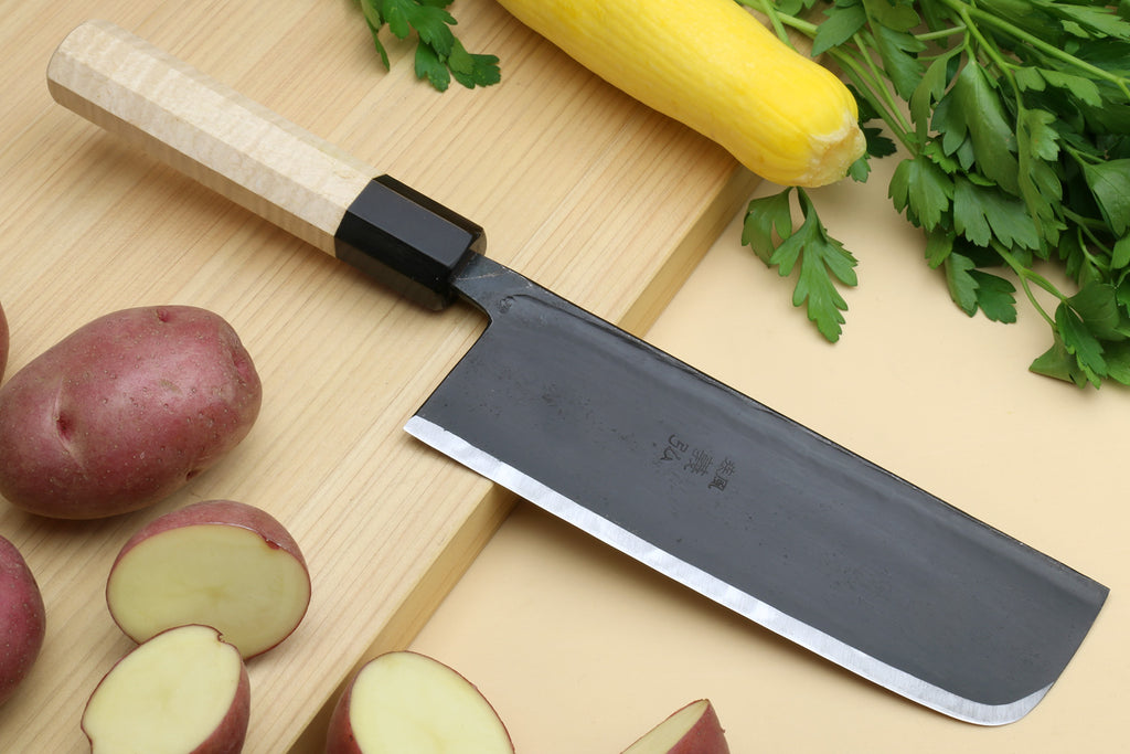 Nakiri Japanese vegetable knife with dark steel blade and light camphor wood handle