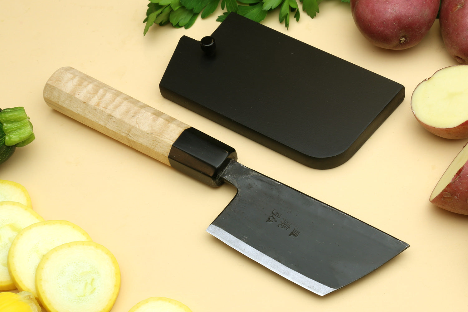 Paring knife and black sheath with camphor wood handle.