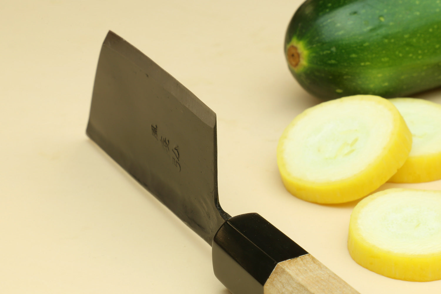 Paring knife with dark steel blade and camphor wood handle.