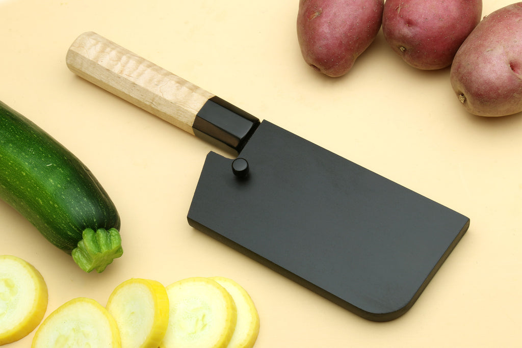 Paring knife with sheath, camphor wood handle and dark blade.