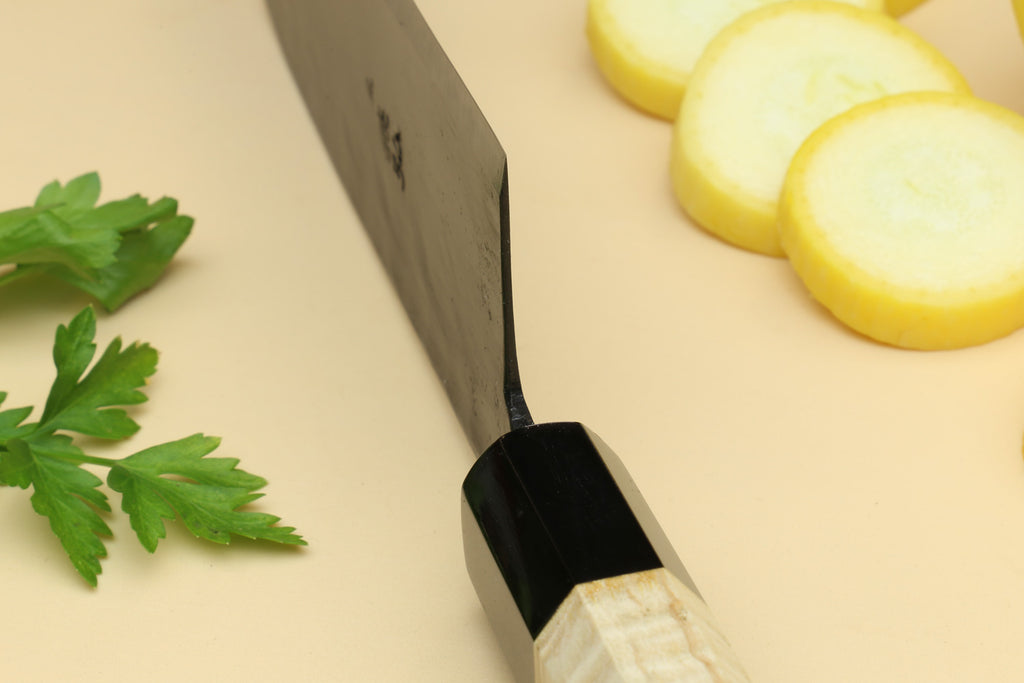 Santoku knife heel and handle detail: black ferrule and camphor wood