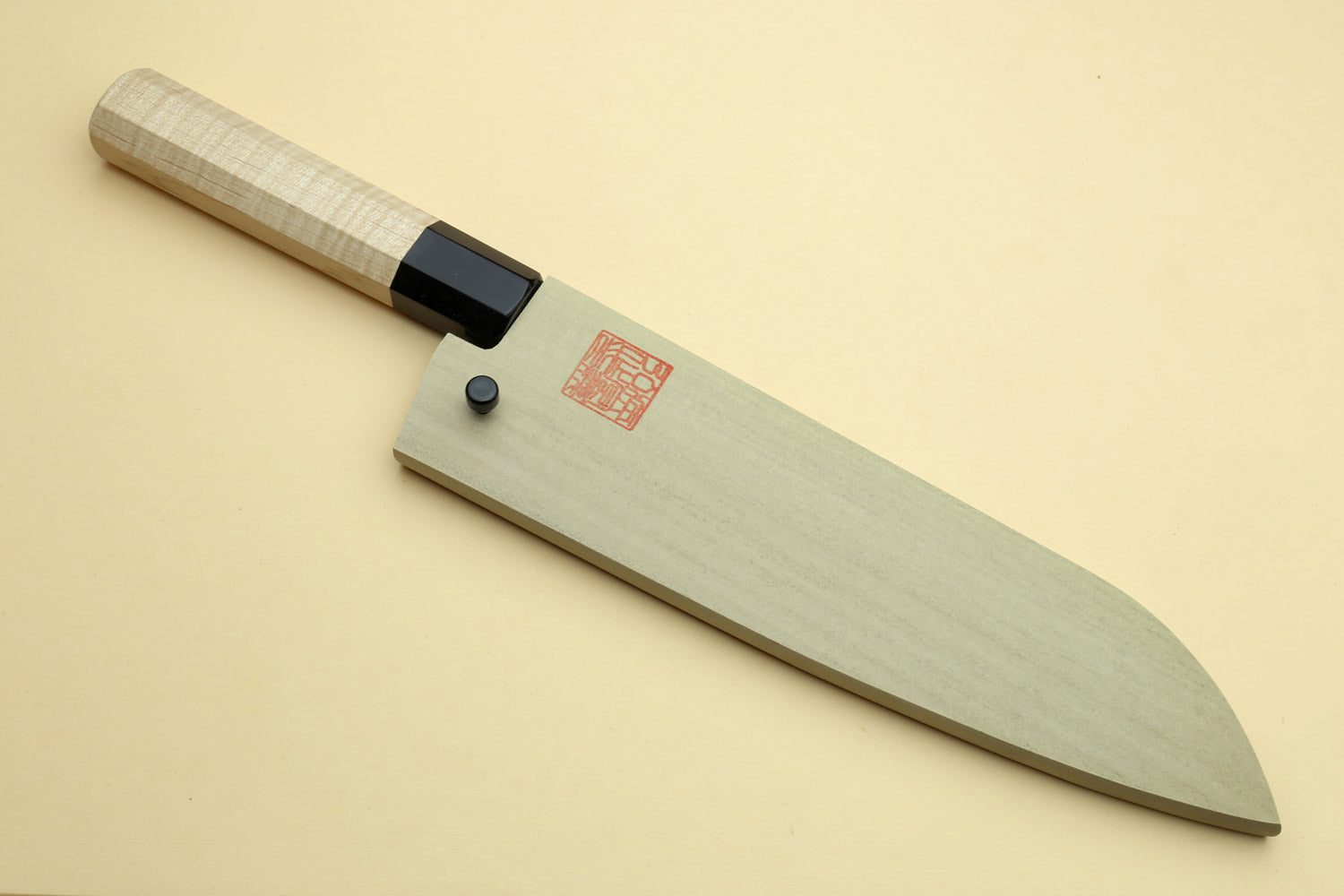 Santoku chef knife with light camphor handle and dark blade, no saya cover