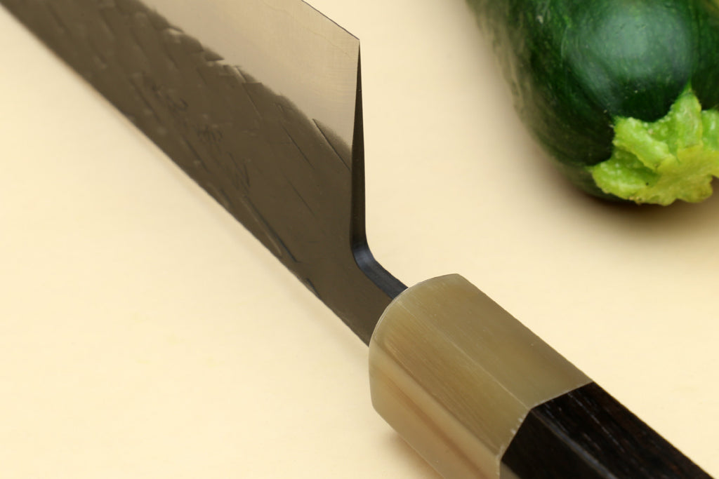 Gyuto chef's knife bolster and dark handle, black blade with speckled texture
