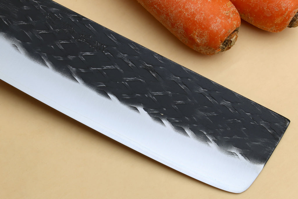 Nakiri blade front view with dark textured finish and white edge
