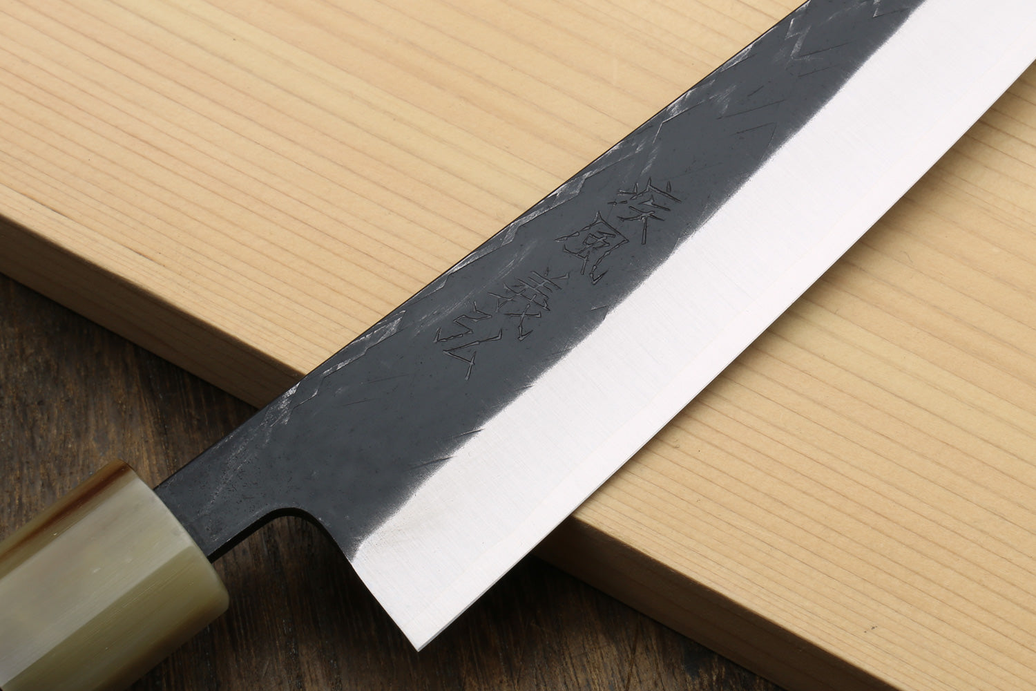 Petty-utility knife blade close-up with hammered nashiji texture and stamped marks