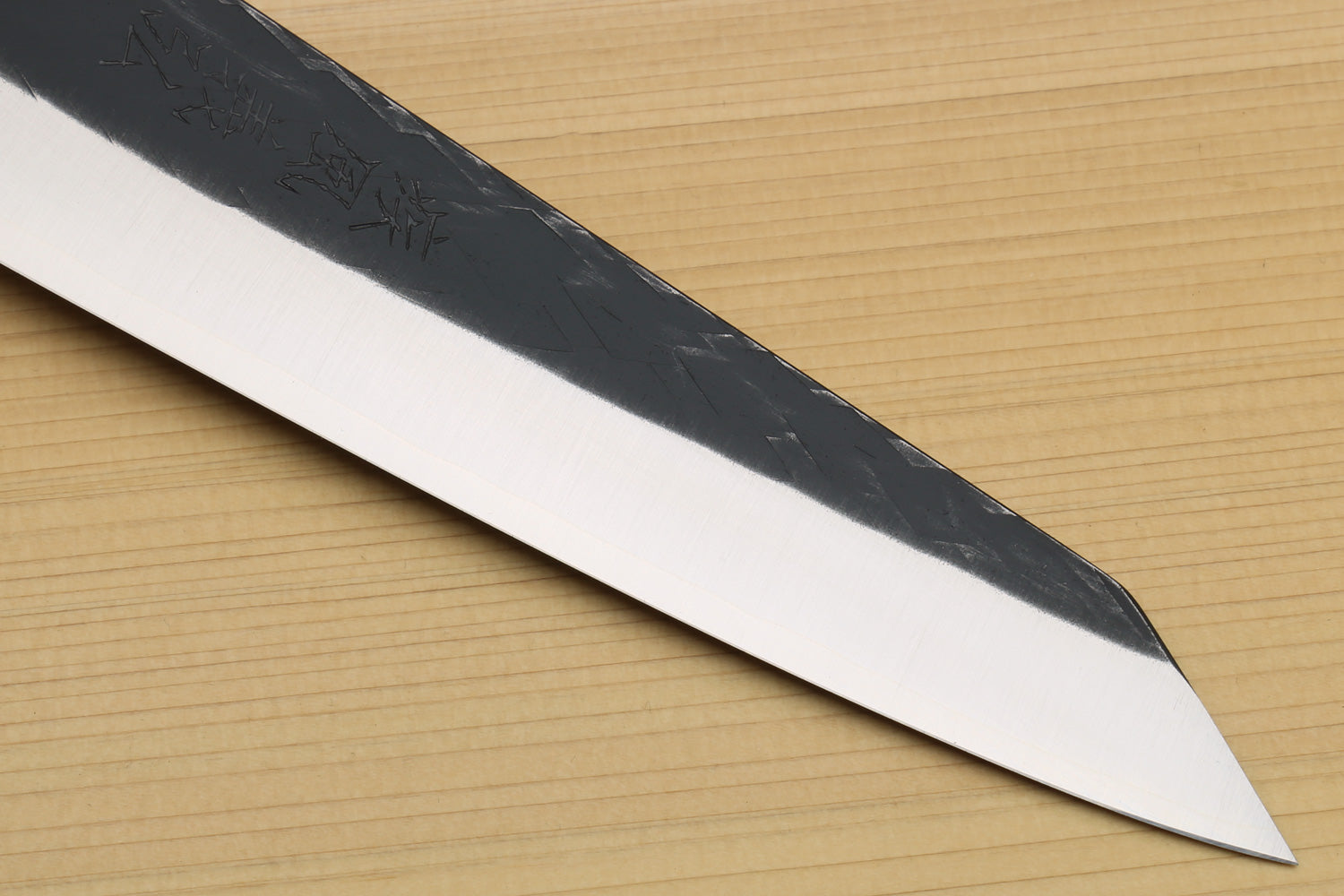 Petty-utility knife tip and edge, textured dark blade with polished cutting bevel