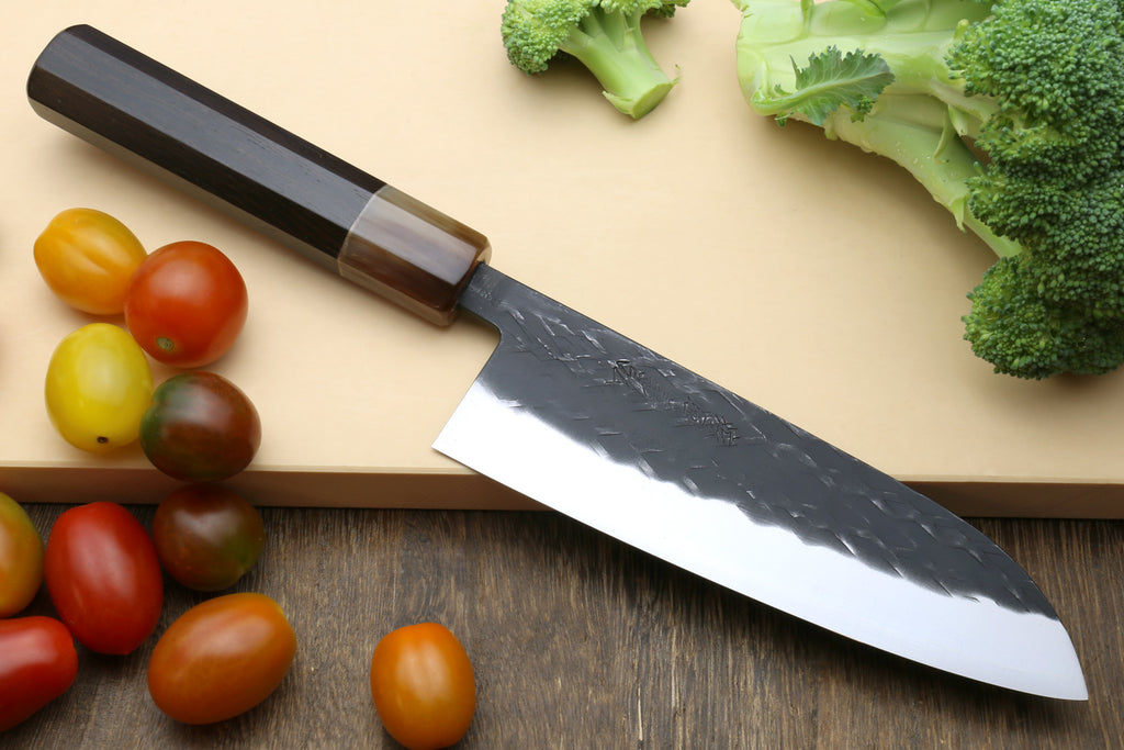 Santoku knife with dark handle and hammered stainless blade
