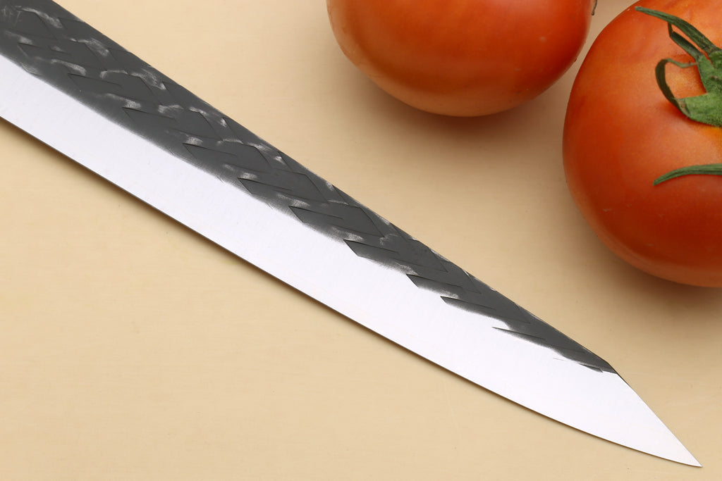 Sujihiki slicer knife with dark hammered pattern on blade and pointed tip