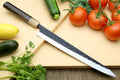 Stainless sujihiki slicer knife with dark patterned blade and black handle