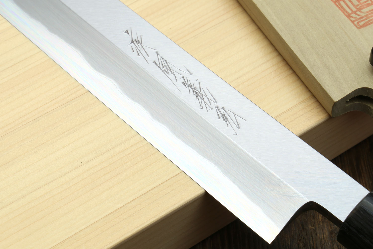 White steel Japanese sushi knife blade with engraved markings