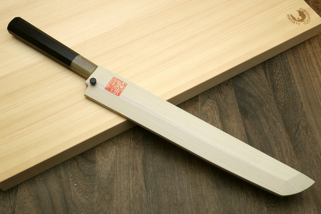Sushi sashimi knife with pale handle and curved white blade, sakimaru point