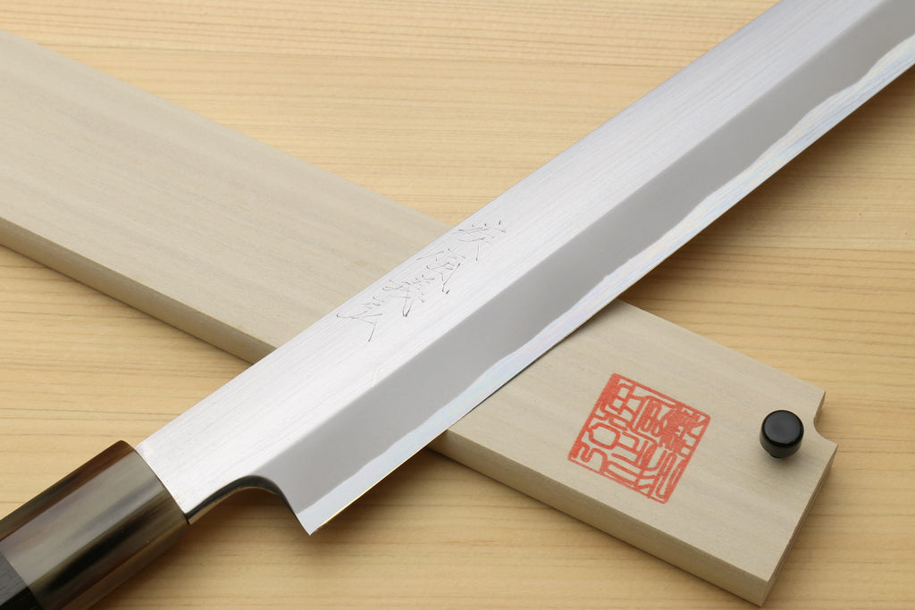 Sashimi sushi knife showing white steel blade profile with wooden saya and red seal