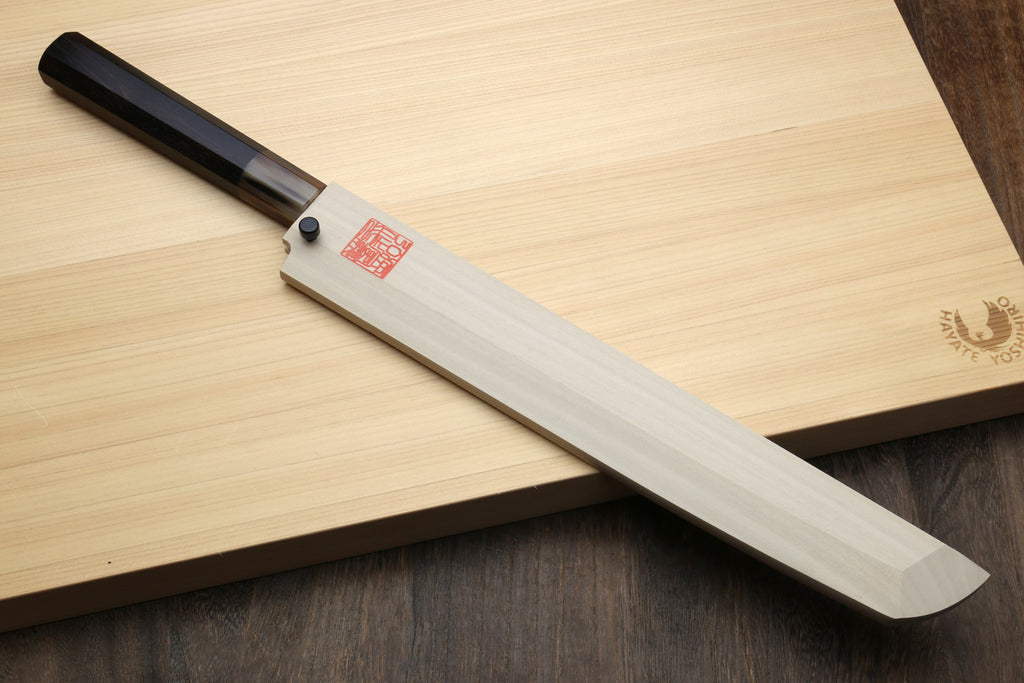 Sashimi sushi knife with white steel blade and dark handle, inside wooden saya