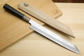 Japanese sushi knife set with white blades and alternating light and dark handles