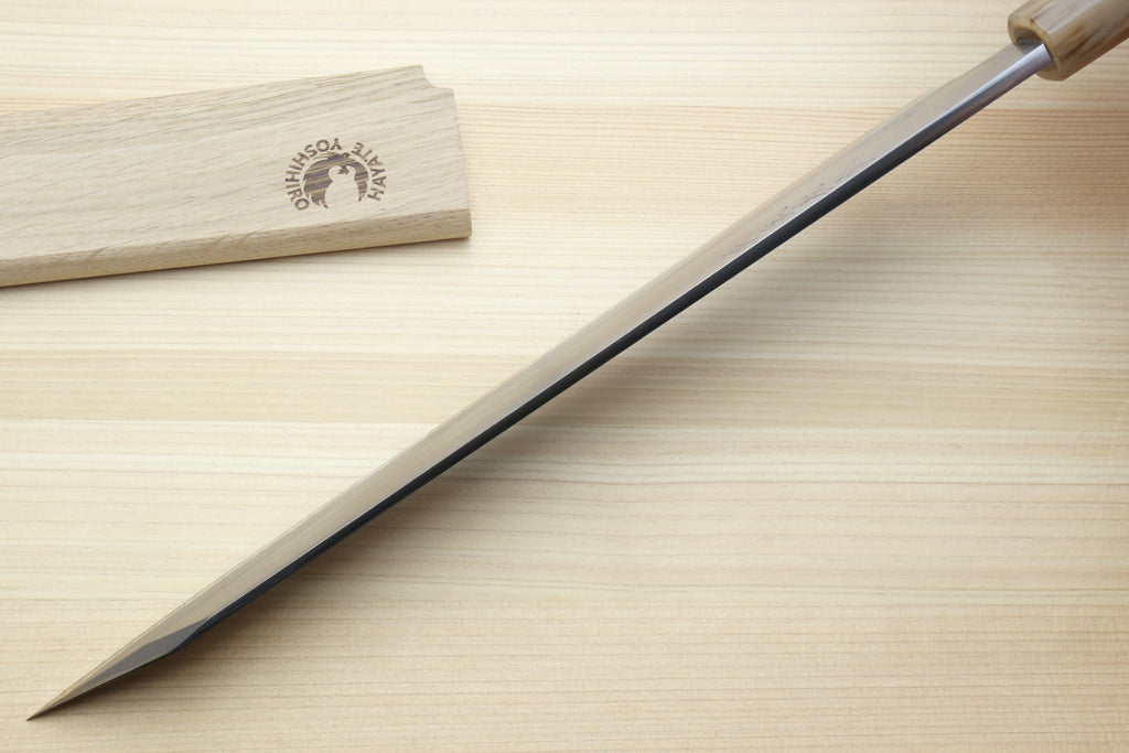 Japanese yanagi-kiritsuke knife with long white steel blade and dark handle