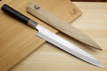 Sashimi yanagiba knife with white blade and dark ebony handle