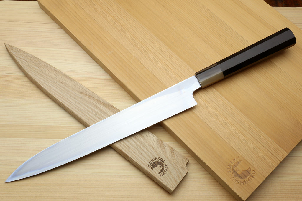 Yanagiba sushi knife with long pointed blade and dark ebony handle