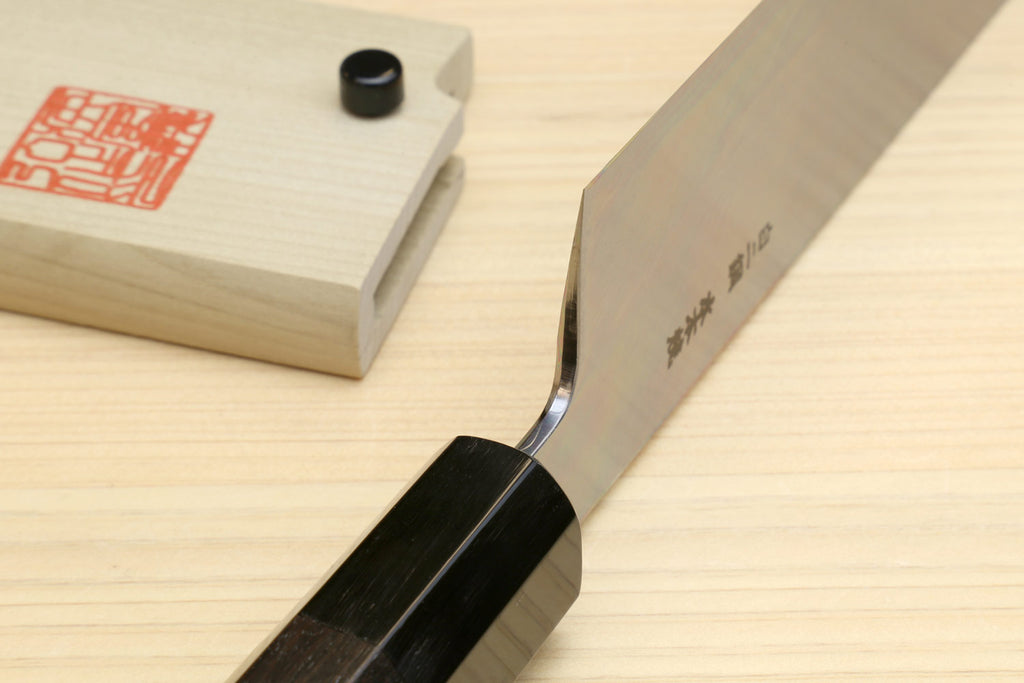 Japanese vegetable knife side view with dark ebony handle and white blade