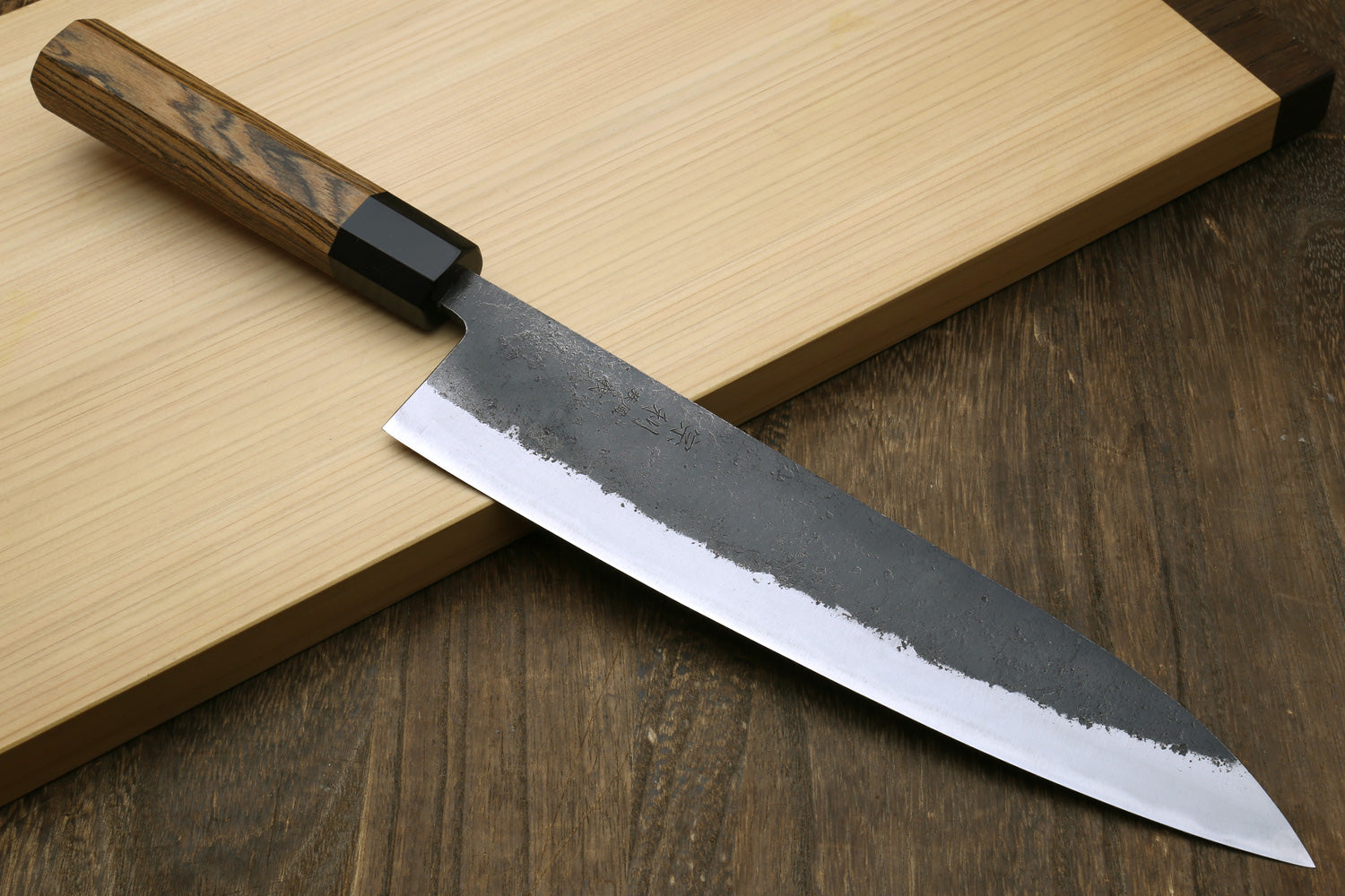 Japanese gyuto chef knife with long white blade, black handle collar, cocobolo grip