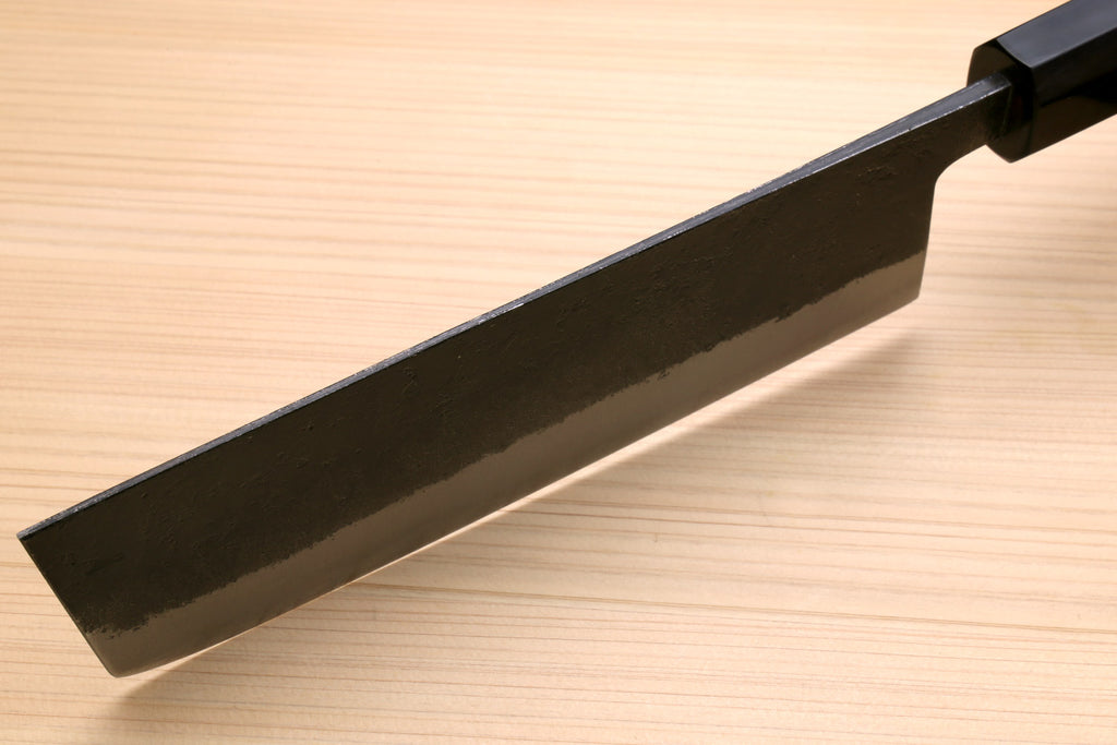 Japanese nakiri knife blade with dark collar and silver steel surface