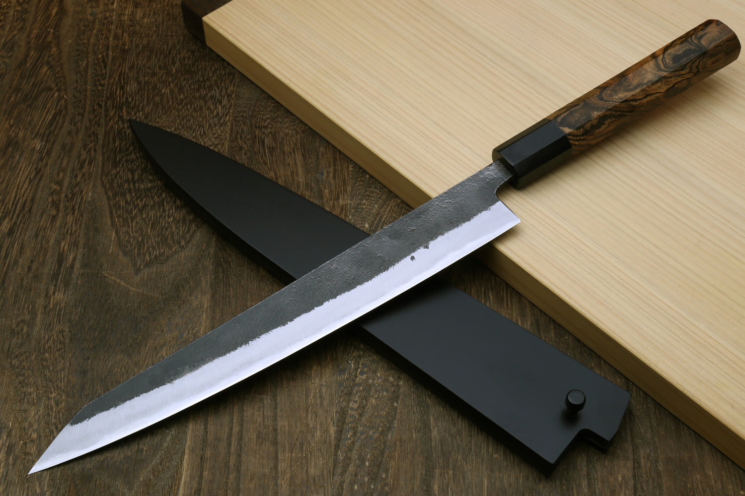 Japanese slicer knife with white-steel blade, dark sheath, and cocobolo handle