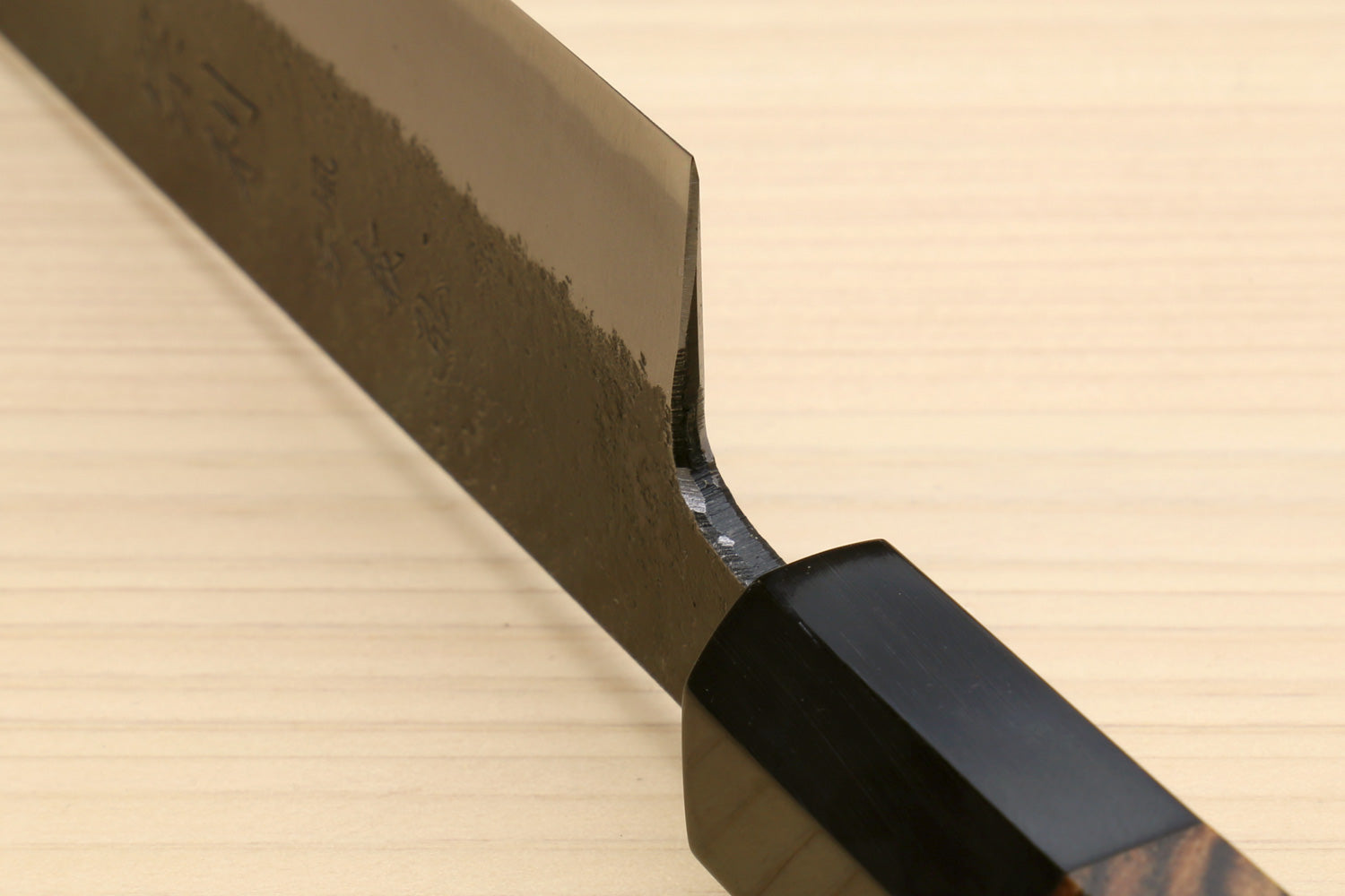 Japanese slicer knife heel section with white blade and black saya cover