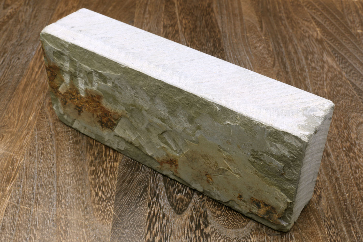Natural sharpening whetstone block, green-gray body with white top surface