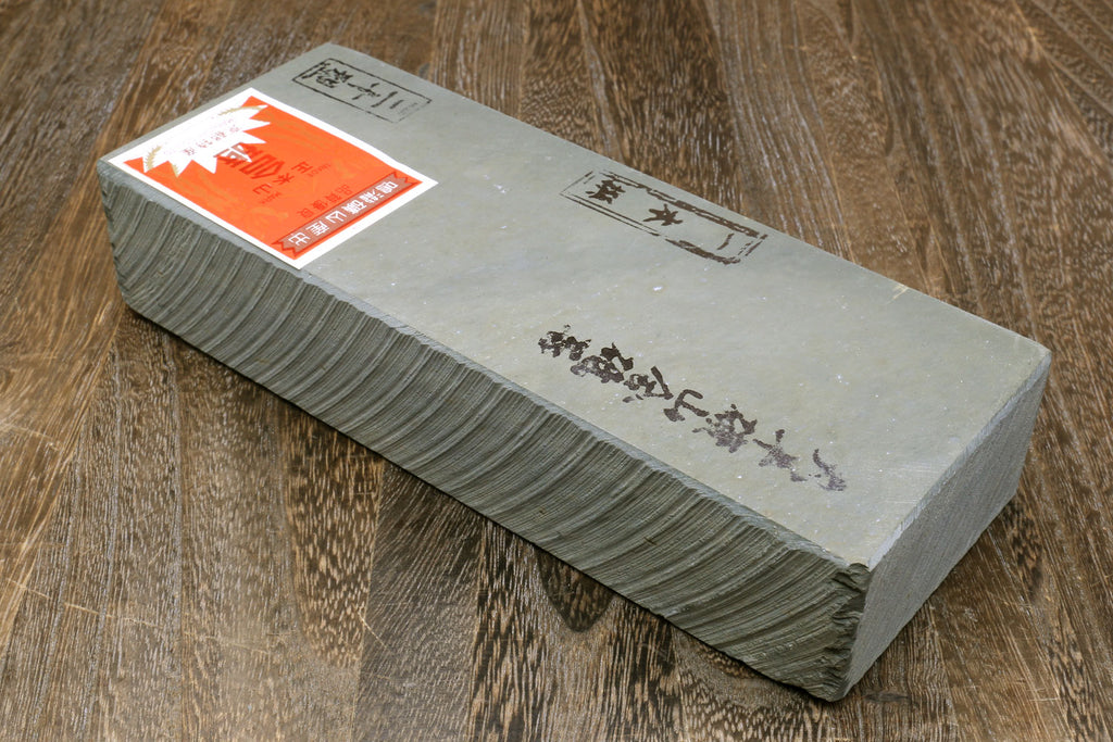 Yoshihiro natural sharpening whetstone, gray rectangular stone with orange label on top