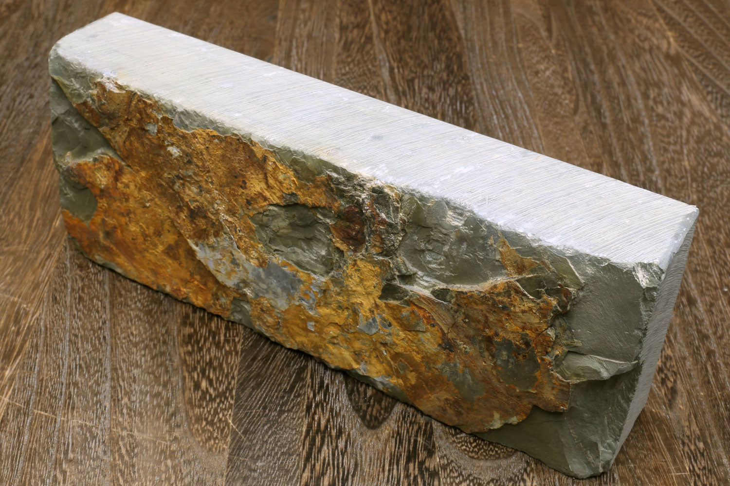 Rectangular natural whetstone with off-white top and rough brown/green side