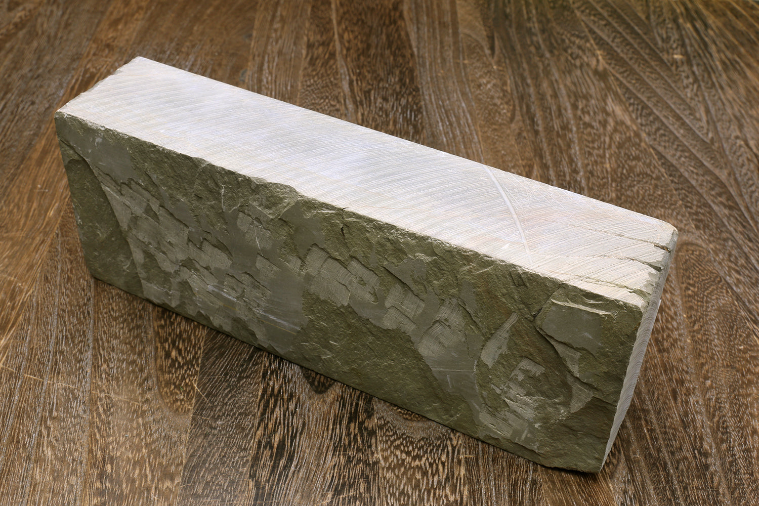 Natural sharpening whetstone, dark green stone block with pale edge