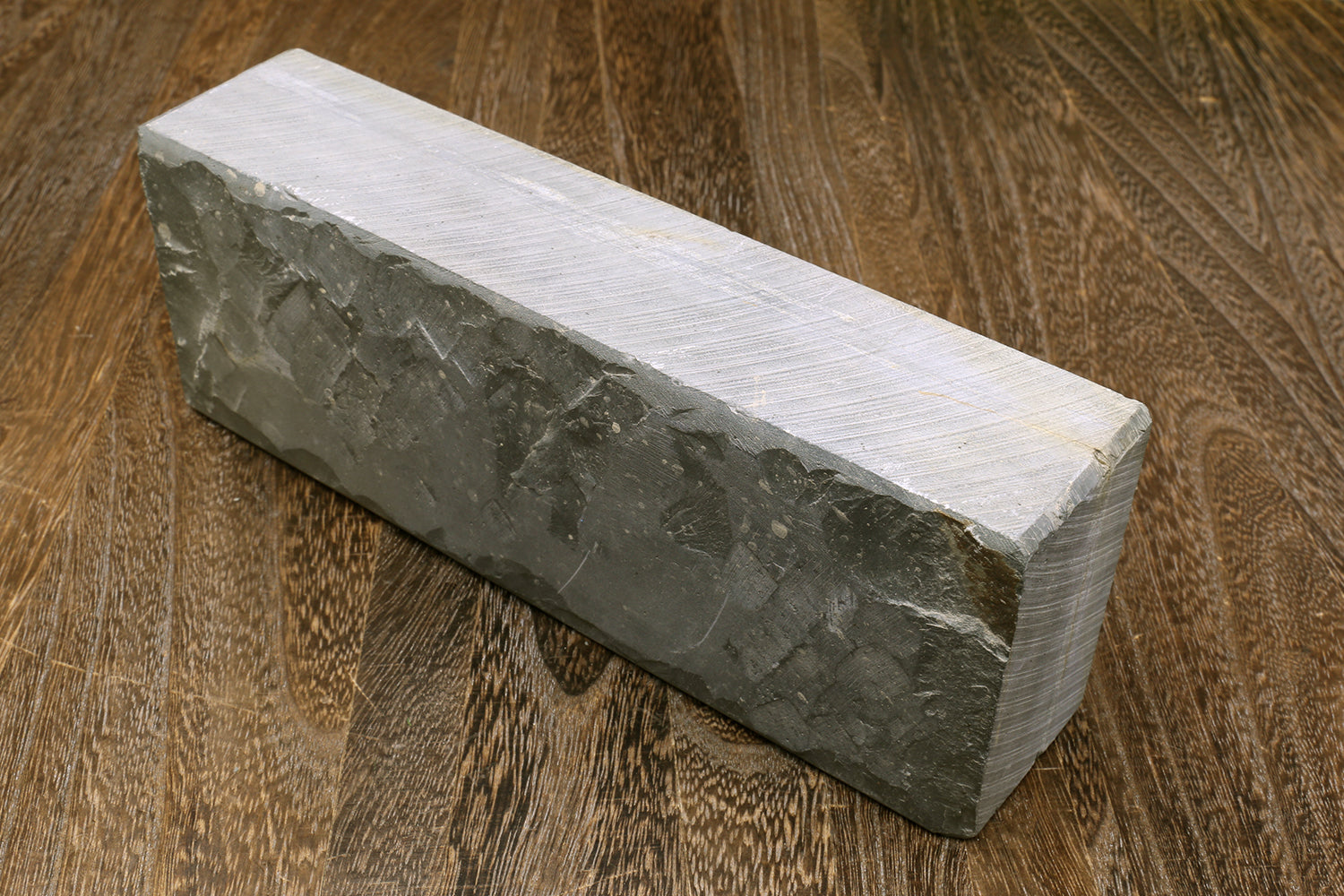 Natural sharpening whetstone block, dark gray with pale top surface