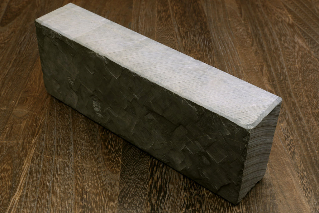 Natural sharpening whetstone block, dark green with pale top faces, rectangular