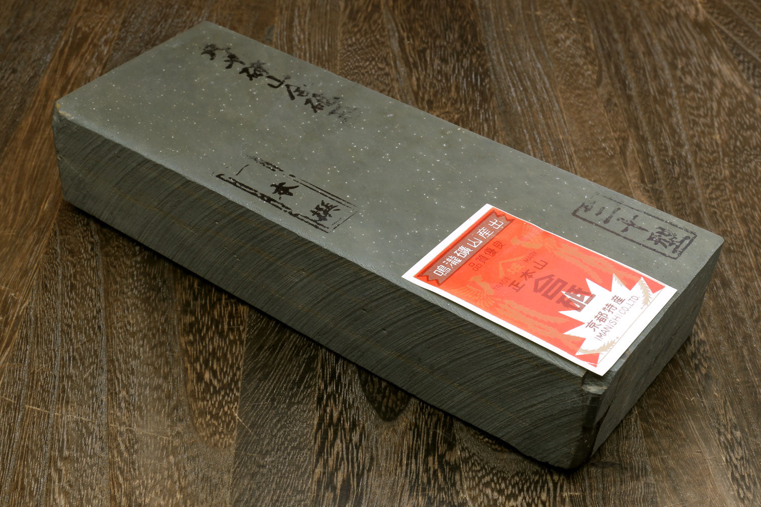 Natural sharpening whetstone block with product label on side