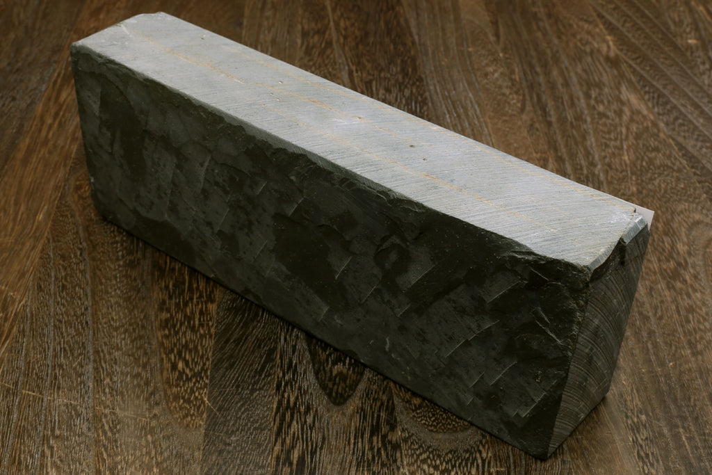 Natural sharpening whetstone block, dark green with pale top surface