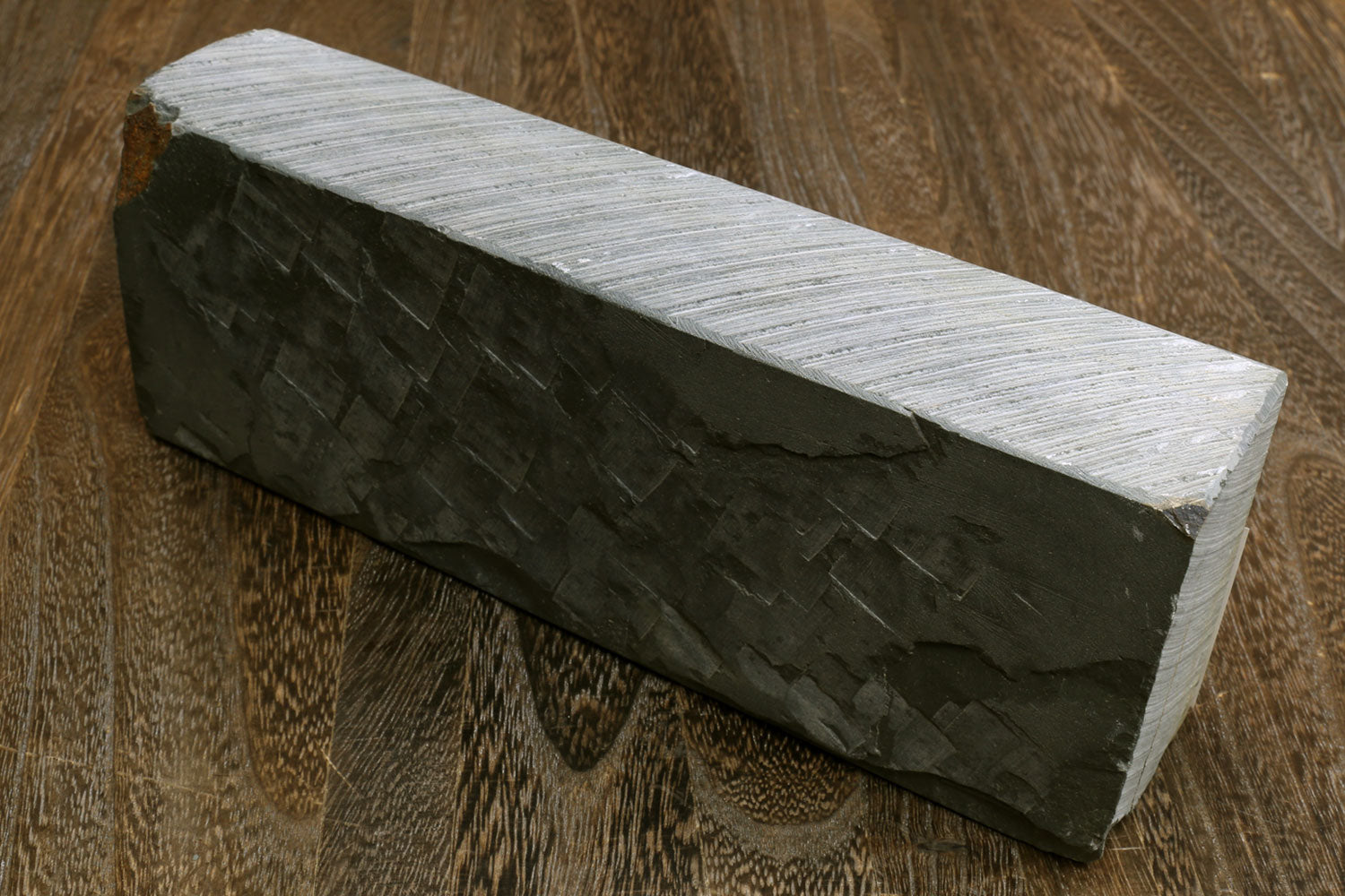 Natural sharpening whetstone block, dark sides and light top, rectangular