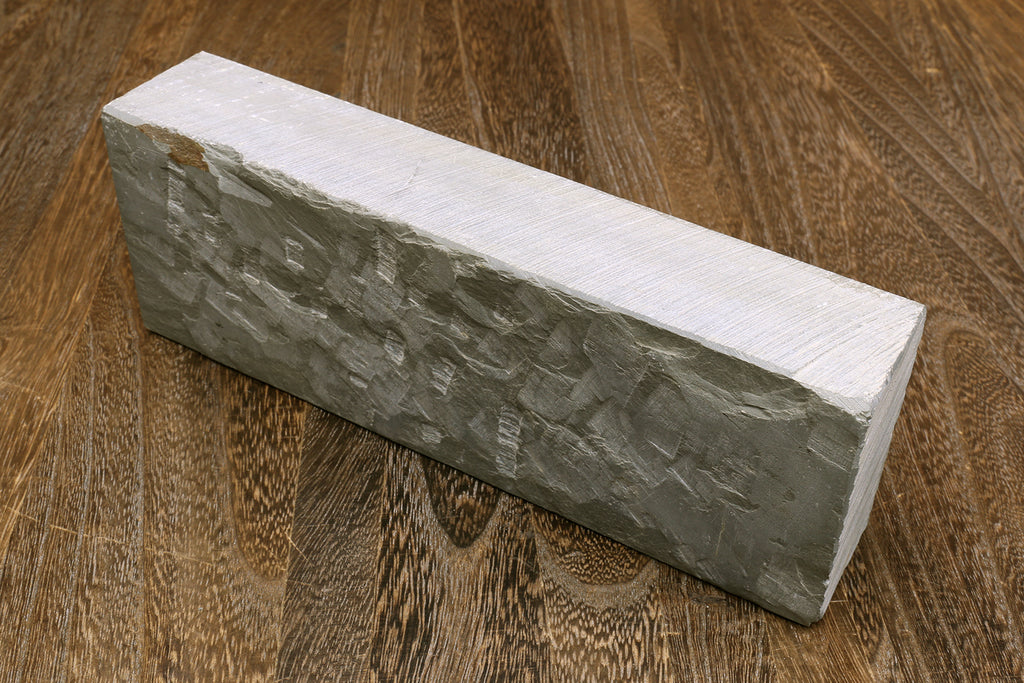 Natural sharpening whetstone block, light gray sides and white top surface