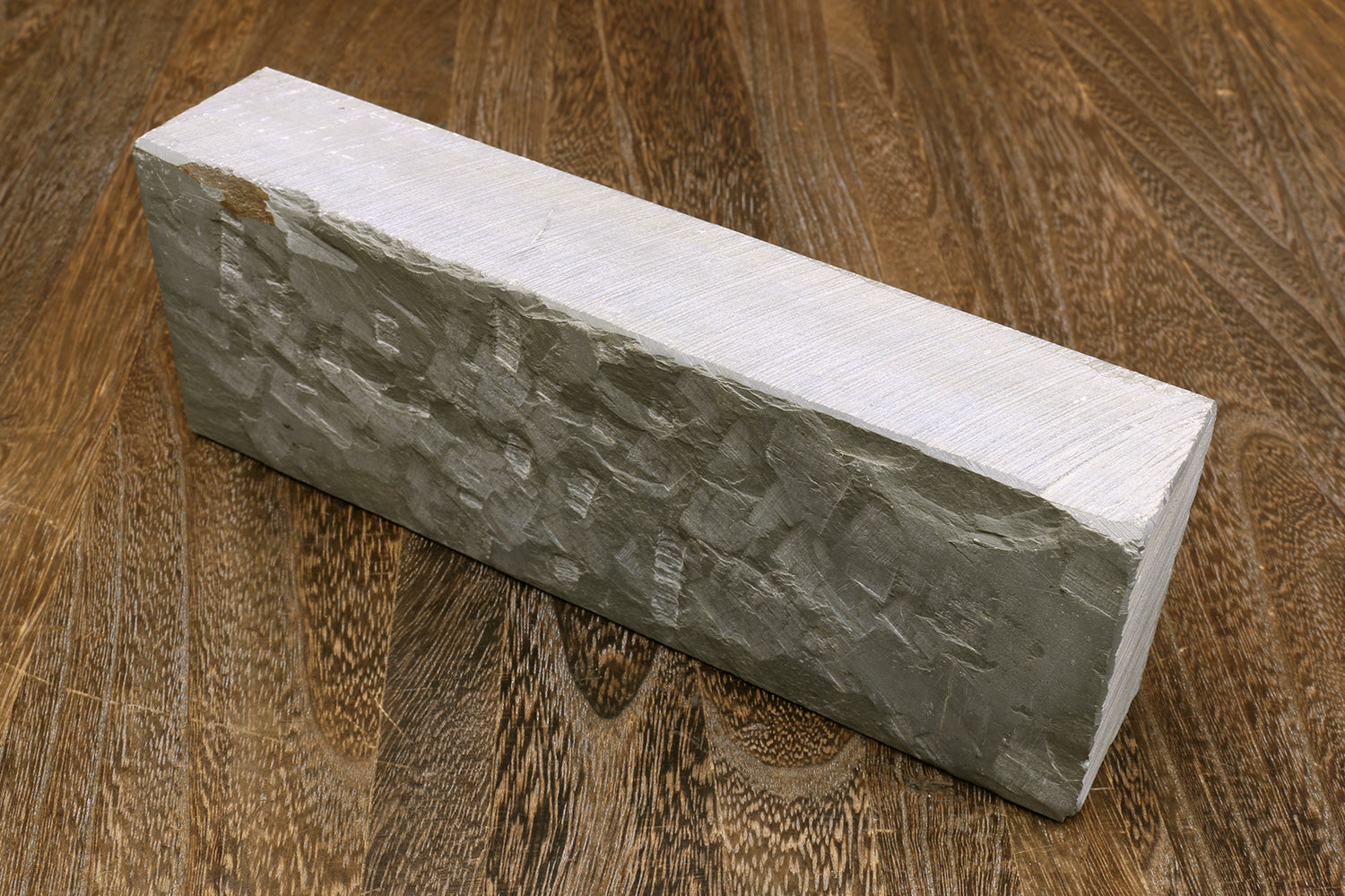 Natural sharpening whetstone block, light gray sides and white top surface