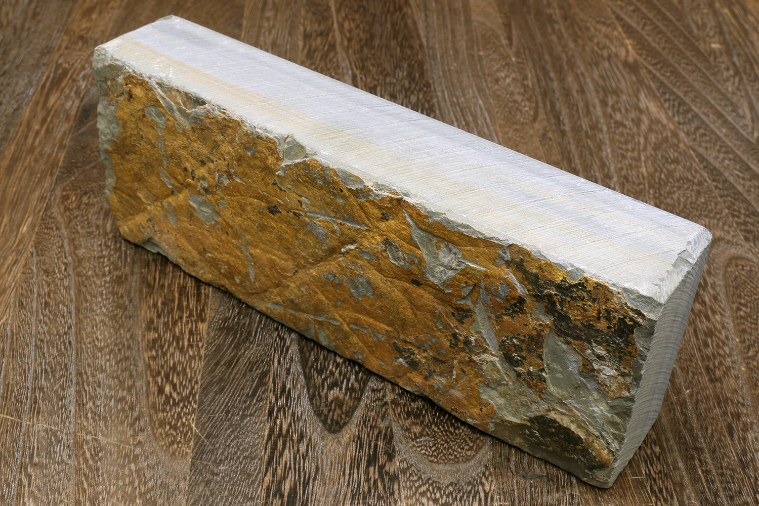 Natural whetstone sharpening stone, rectangular block with mottled dark green-yellow surface