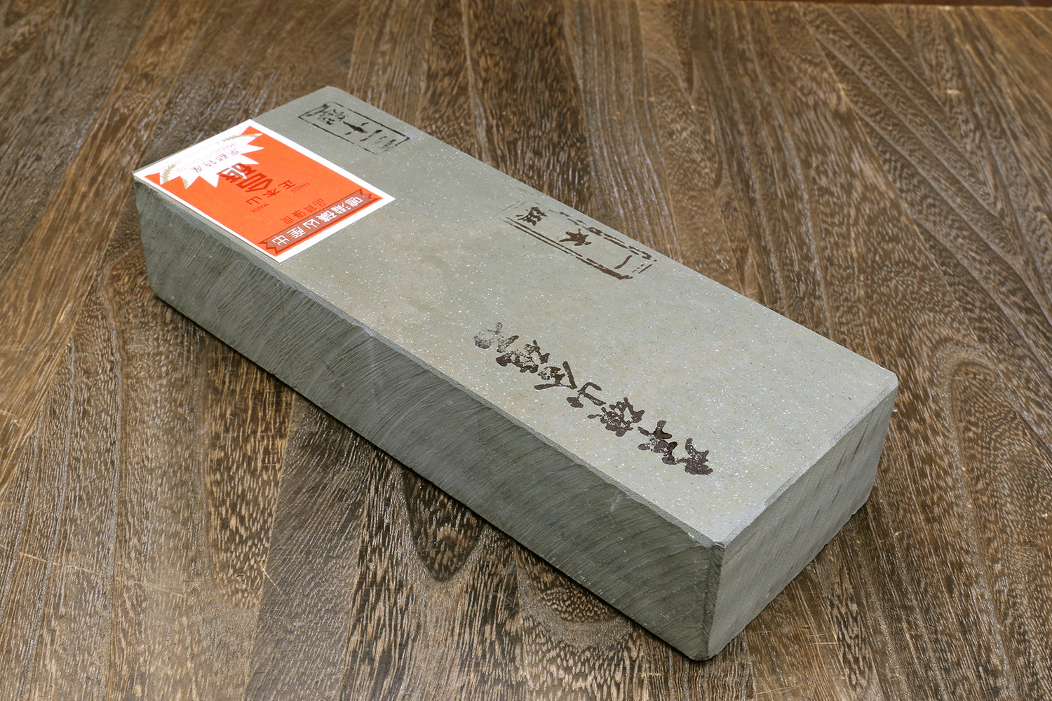 Natural sharpening whetstone finishing block, gray stone with orange label