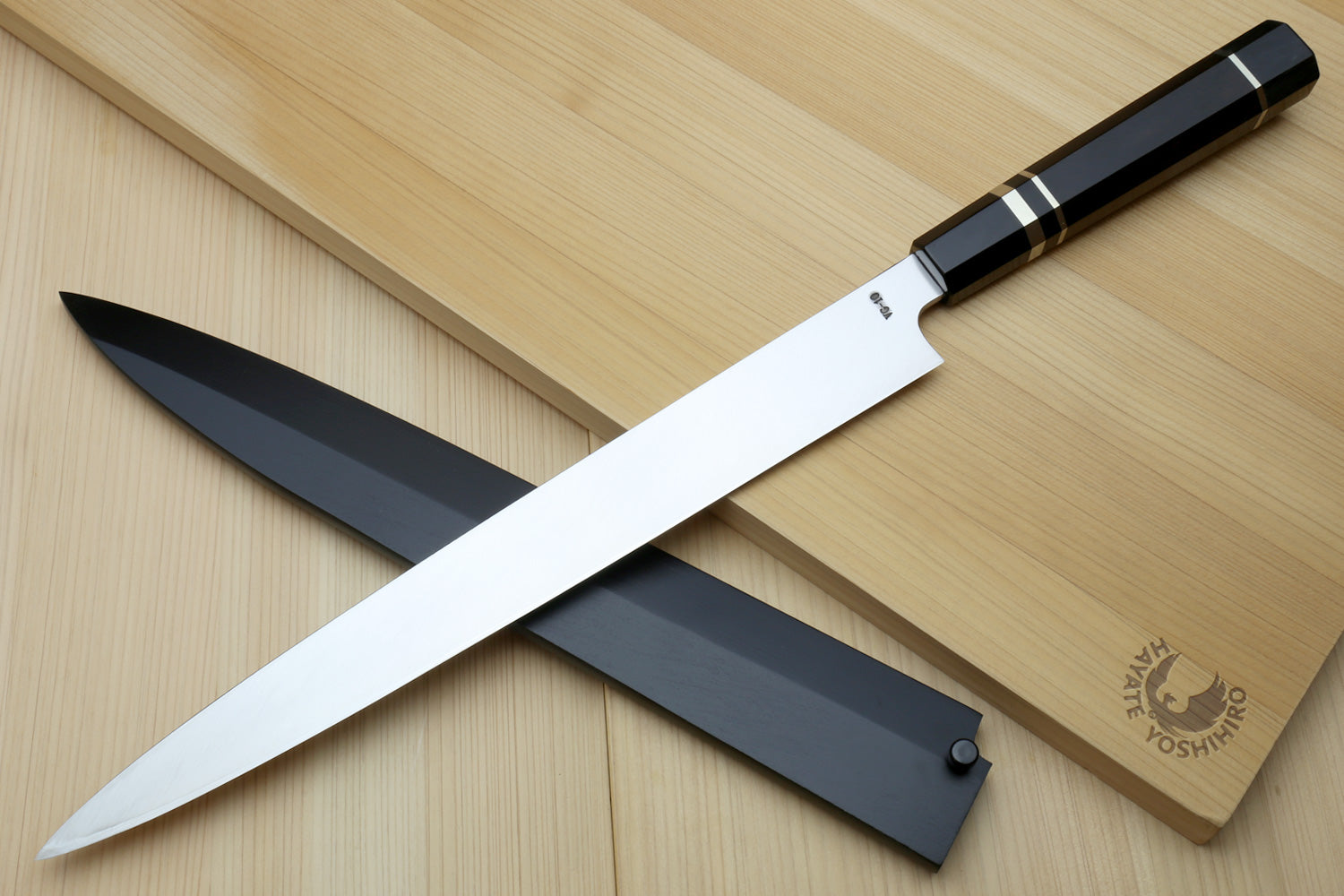 Yoshihiro yanagi sushi knife with mirror blade, ebony handle, and black saya
