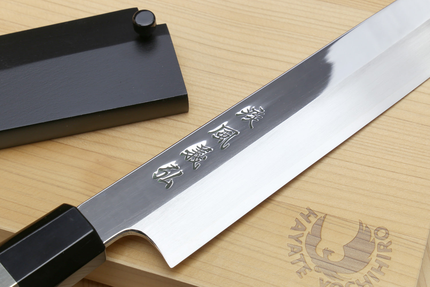Yoshihiro yanagi sushi knife with engraved mirror steel blade and ebony handle
