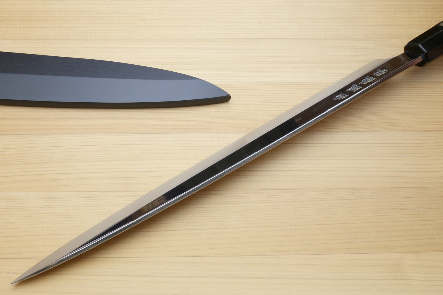 Yoshihiro yanagi sushi knife with pointed mirror-finished blade and ebony handle