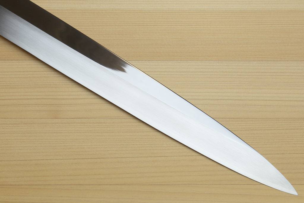 Yoshihiro yanagi sushi knife blade with mirror-finished steel and dark handle
