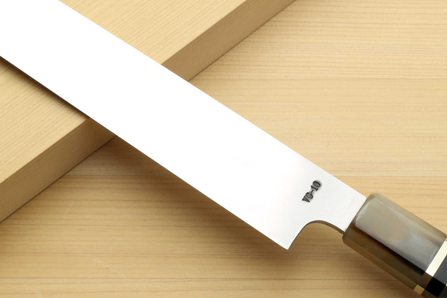 Yanagi sushi knife handle end with horn bolster and mirror blade with emblem